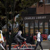 students walking past the Charles Library